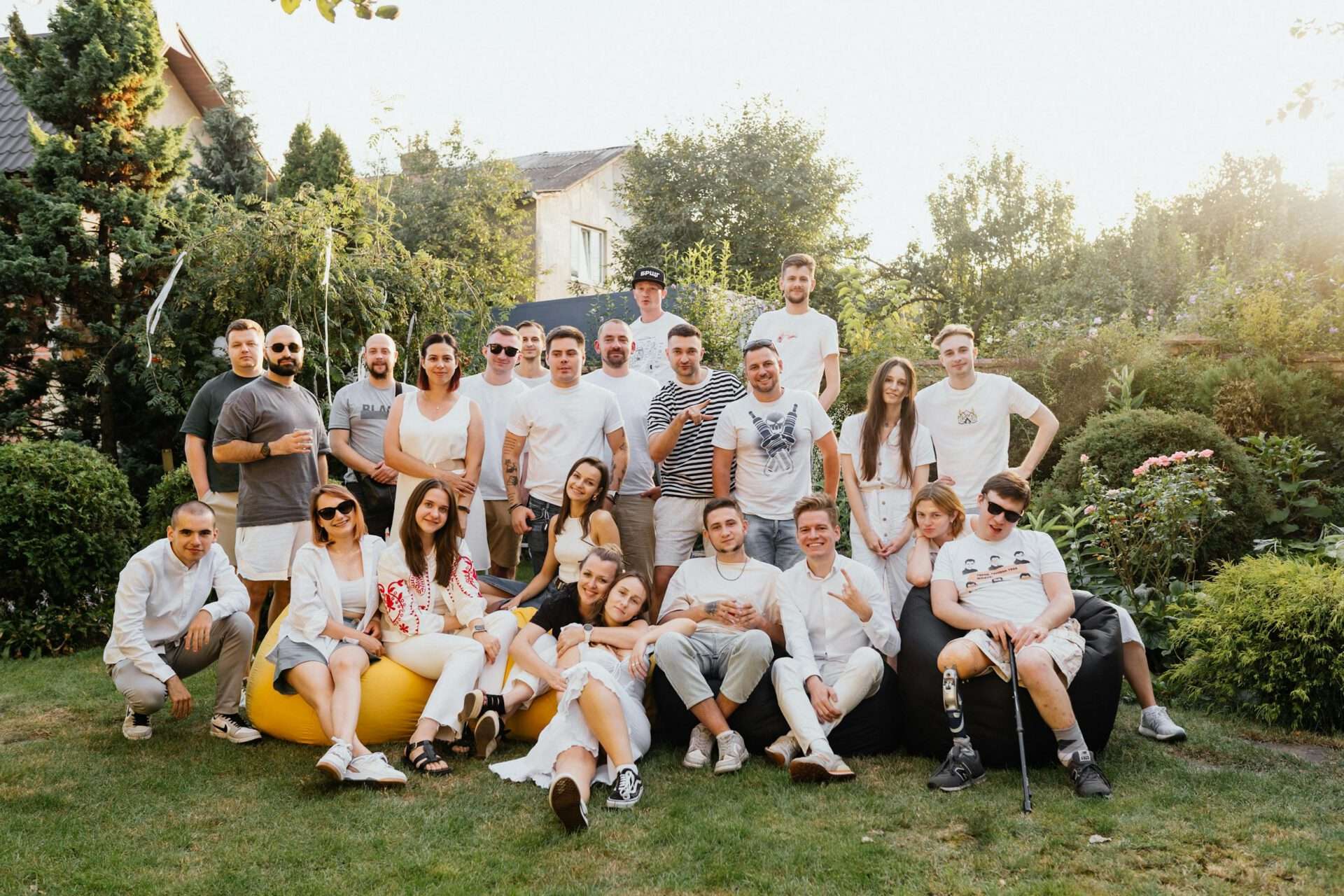 A Group of Young People Posing Together for a Picture in the Garden
